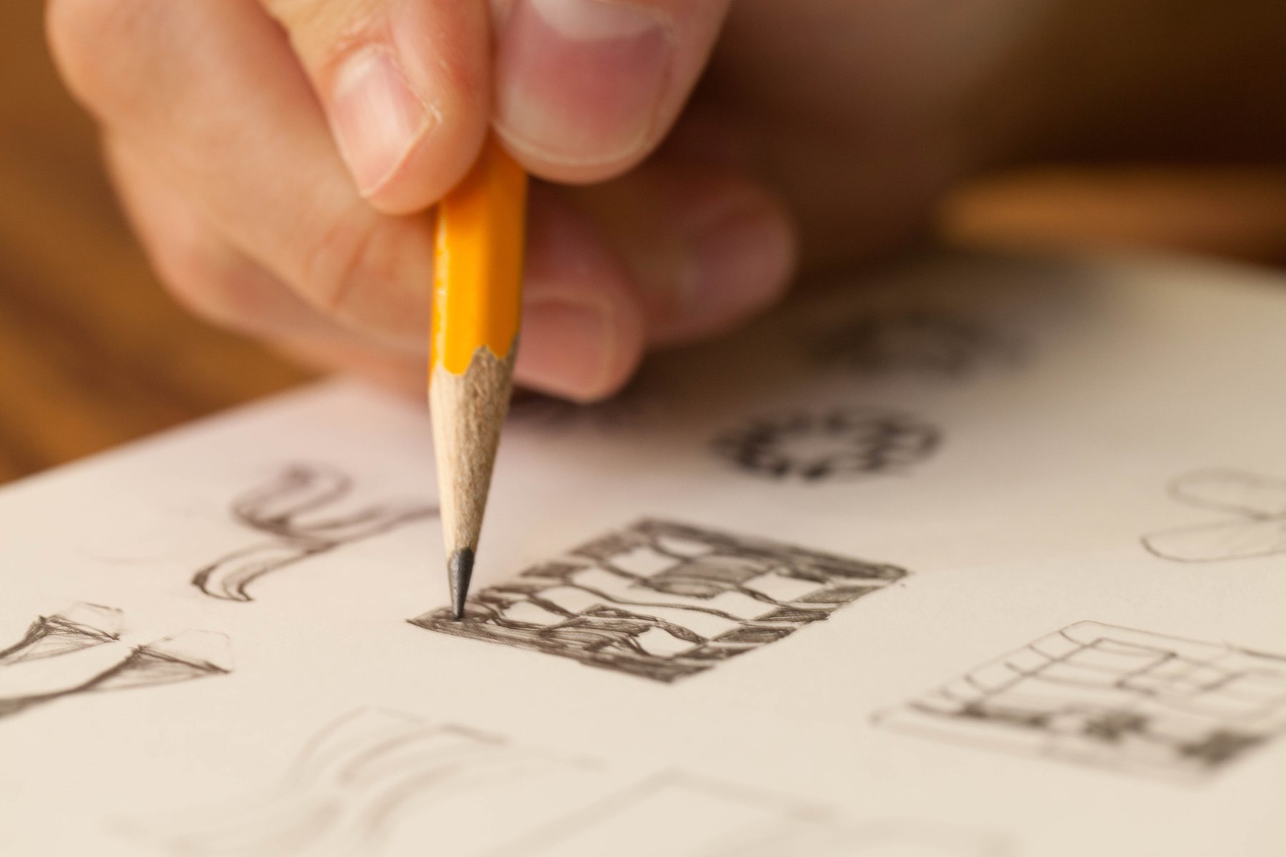 A Pennebaker designer sketching identity concepts by hand